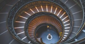 Intricate spiral staircase design in Vatican City offering a stunning architectural perspective.